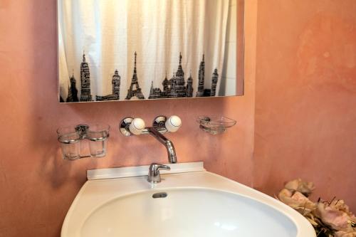 a bathroom with a sink and a mirror at Blattenheimat - im traditionellen Appenzeller Haus in Appenzell