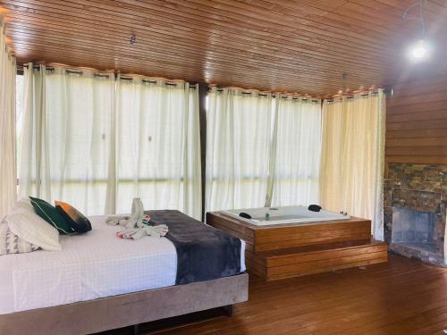 Postel nebo postele na pokoji v ubytování Recanto- Pousada Cachoeira da Neve