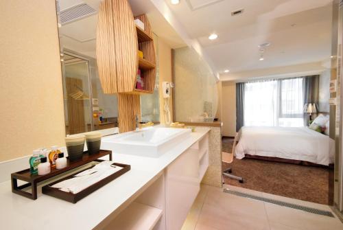 Postel nebo postele na pokoji v ubytování NAGAHIRO Hotel