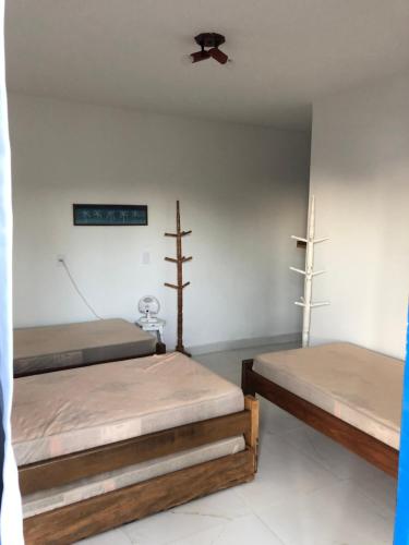 A bed or beds in a room at Casa praia vista mar ttg