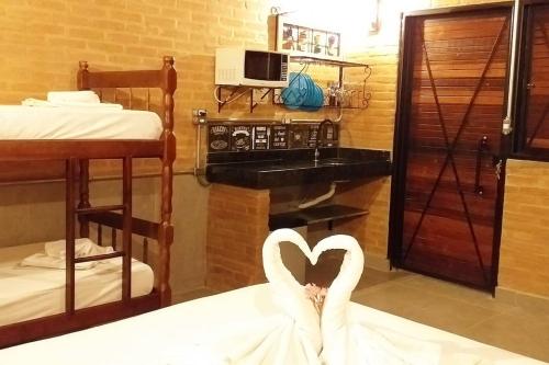 a swan in the middle of a room at La Villa Chalés in Serra Negra