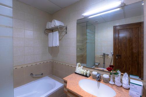 Kylpyhuone majoituspaikassa Grand Al Safi Hotel