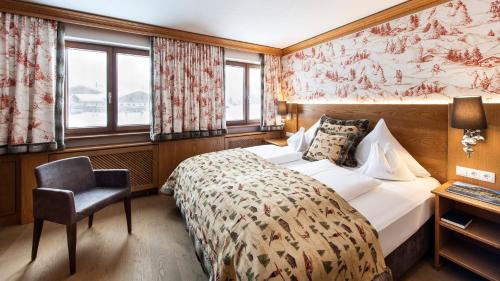 Ένα ή περισσότερα κρεβάτια σε δωμάτιο στο Hotel & Chalet Montana