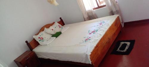 Een bed of bedden in een kamer bij Green Villa