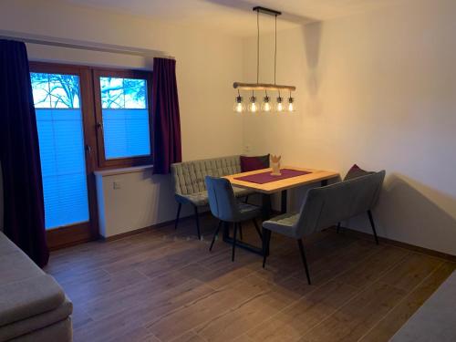a dining room with a table and chairs at Appartments Zirbennest in Schladming