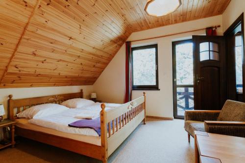 Postel nebo postele na pokoji v ubytování Gustaw-Mazury - Całoroczny dom nad jeziorem Kalwa