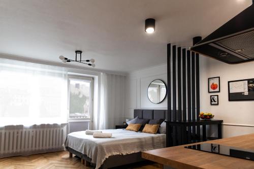 Posteľ alebo postele v izbe v ubytovaní Studio Kolberga Kraków
