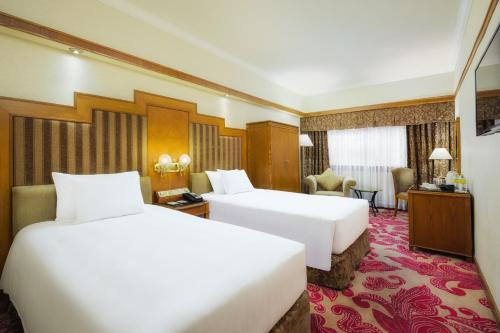 En eller flere senge i et værelse på Hotel Sintra