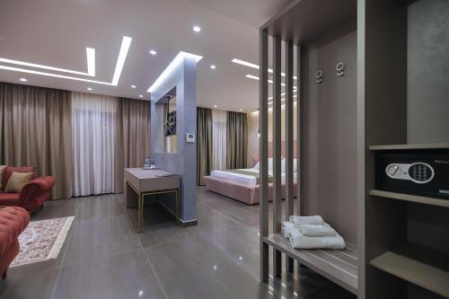 a hotel room with a bedroom with a bed at Brilliant Hotel & SPA in Golem
