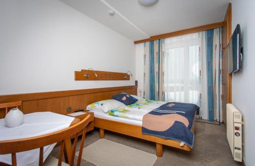 A bed or beds in a room at Appartementhaus Franz Samonig