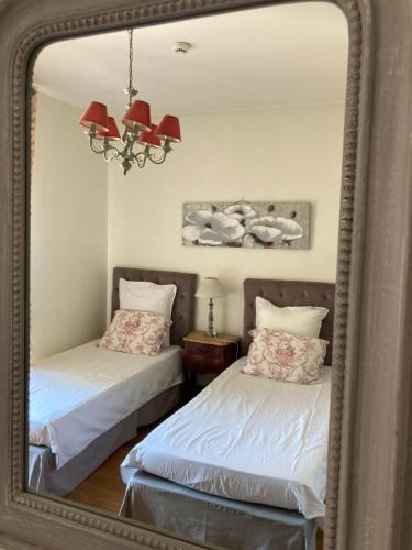 Una cama o camas en una habitación de Hotel La Regence