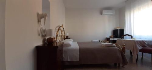 Ένα ή περισσότερα κρεβάτια σε δωμάτιο στο BeeLiving Room&Breakfast