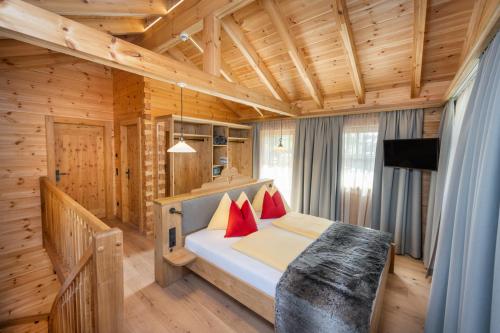 Krevet ili kreveti u jedinici u objektu Dorf-Chalets Filzmoos mit Sauna