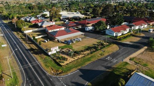 an aerial view of a small town with a street at Golfers Inn in Tenterfield