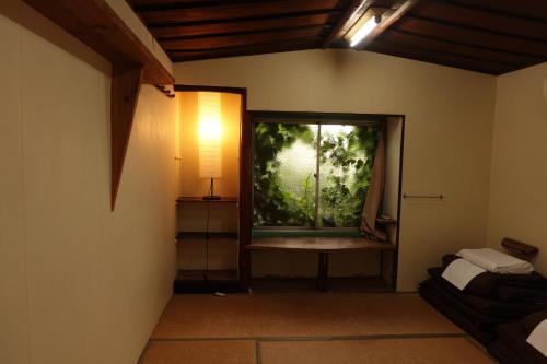 Letto o letti in una camera di Air Osaka Hostel
