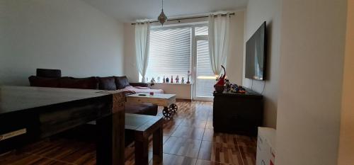 a living room with a couch and a table at Domček 22 in Dudince