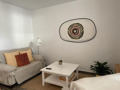 a living room with a couch and a table at Casa Olivera- apartament al Passeig Font Vella in Sant Hilari Sacalm