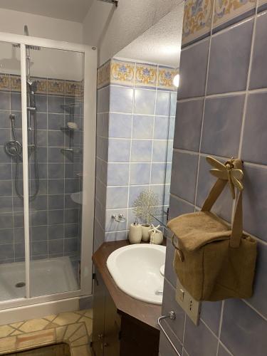 a bathroom with a sink and a shower at Adamas Domus in Taormina