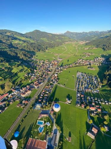 an aerial view of a park with cars at Thalhof Apartments in Brixen im Thale