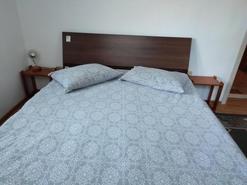 Un pat sau paturi într-o cameră la Vila Brazilor