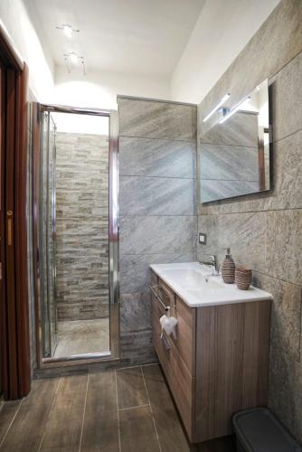 a bathroom with a sink and a shower at Casa Ceragioli in Viareggio