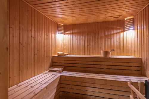 a wooden sauna with a bench in it at Kiwengwa Beach Resort in Kiwengwa