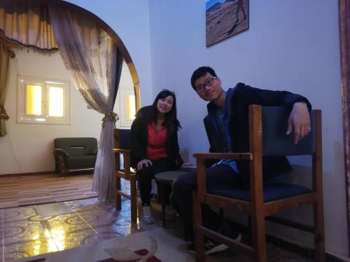 a man and a woman sitting in a chair at Safari Abu Simbel in Abu Simbel
