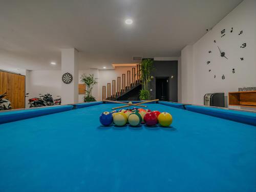a pool table with balls on top of it at Villa Mimpi Bali in Jimbaran