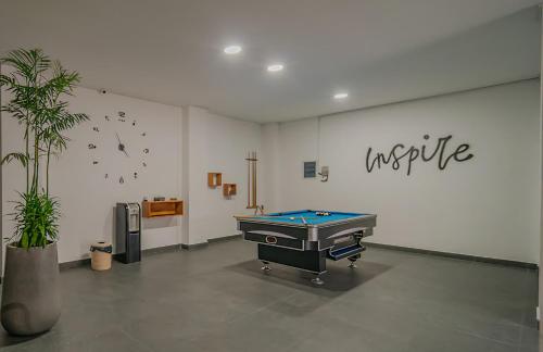 a room with a pool table in the middle of it at Villa Mimpi Bali in Jimbaran