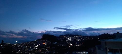 a view of a city at night at B2B Home Stay in Kodaikānāl