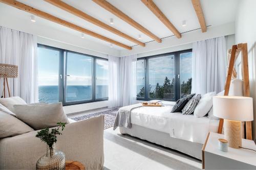 A bed or beds in a room at Luxury Villa Terra Promessa - Paxos