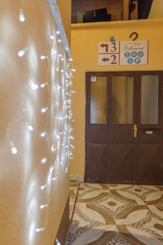a pair of doors in a building with lights on it at Studio Apartments KIM - Dilberovic in Mostar