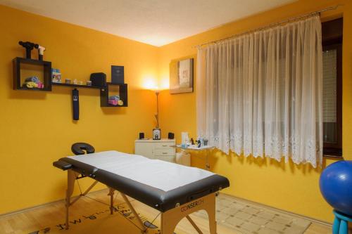 a hospital room with a bed and a window at Studio Apartments KIM - Dilberovic in Mostar
