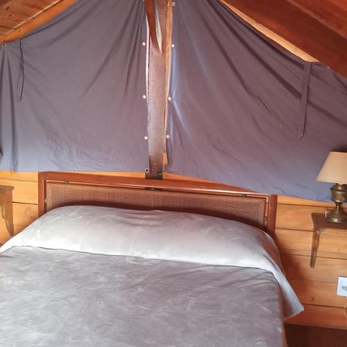Llit o llits en una habitació de Cabañas 5 Brujas