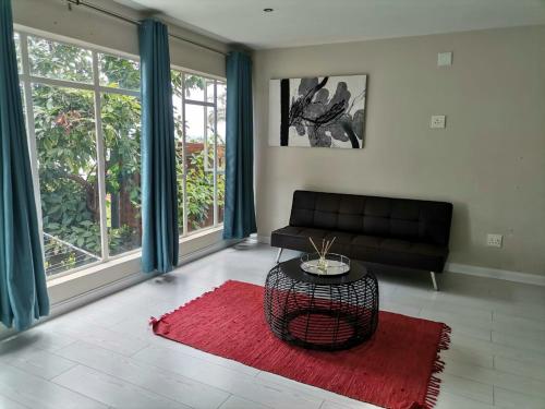 منطقة جلوس في Manz' amahle Guest Cottage