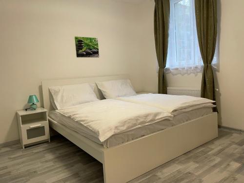Postel nebo postele na pokoji v ubytování Apartmant T&T