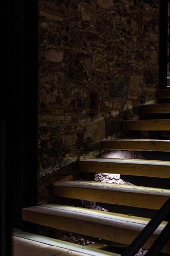 a set of stairs in front of a brick wall at Casa 1810 Parque Hotel Boutique in San Miguel de Allende