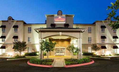 a rendering of the front of a hotel at Hawthorn Suites by Wyndham College Station in College Station