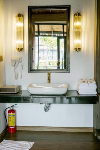a bathroom with a sink and a window at Good Time Relax Resort in Kampot