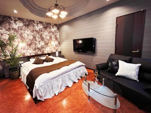 Cama o camas de una habitación en Hotel LEXY旧Tsubakikan Adult Only