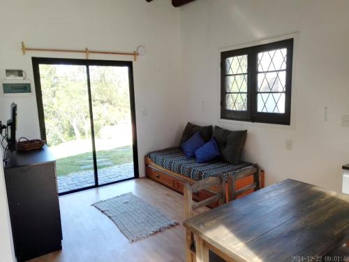 a living room with a couch and a table at Benteveo in Cuchilla Alta