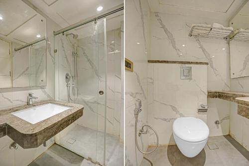 a bathroom with a shower and a toilet and a sink at The Pinky Villa - Heritage Boutique Suites- New Delhi in New Delhi