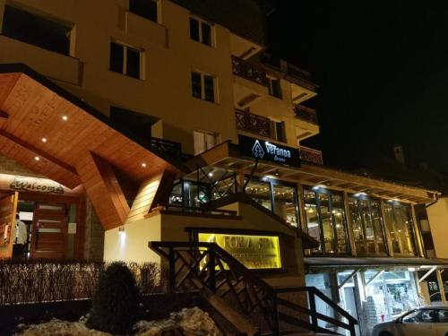 a building at night with a building at FOKA SPA APARTMANI 30 m from Junior in Brzeće
