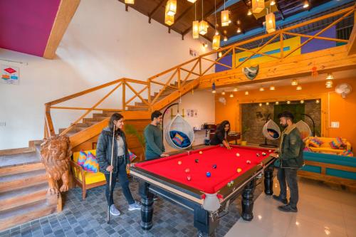 a group of people standing around a pool table at goSTOPS Dehradun, Maldevta in Dehradun