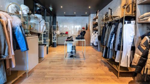 a store aisle with clothes on display at Hôtel Le Diamond Rock in Tignes