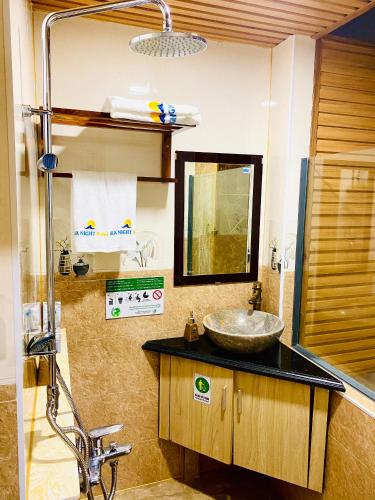 a bathroom with a sink and a mirror at Sea Night - Sea Home Hotel in Phan Thiet