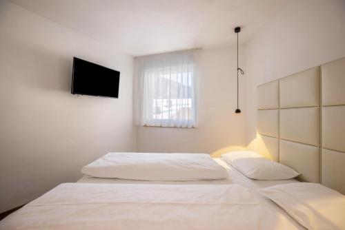 Postel nebo postele na pokoji v ubytování Apartment Sis Residence Bun Ste