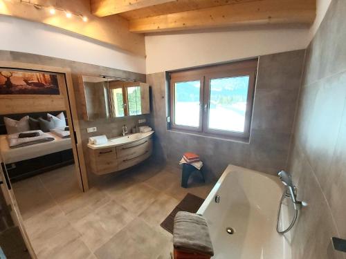 Postel nebo postele na pokoji v ubytování Puitbach Chalet