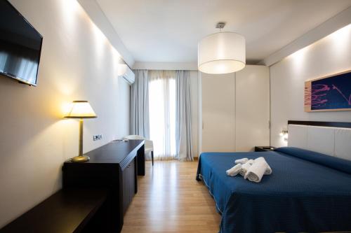 Postel nebo postele na pokoji v ubytování Hotel Aurora e del Benessere