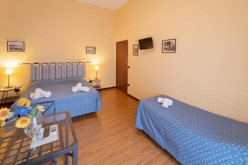 Ένα ή περισσότερα κρεβάτια σε δωμάτιο στο Medina H. Napoli Centro, by ClaPa Group